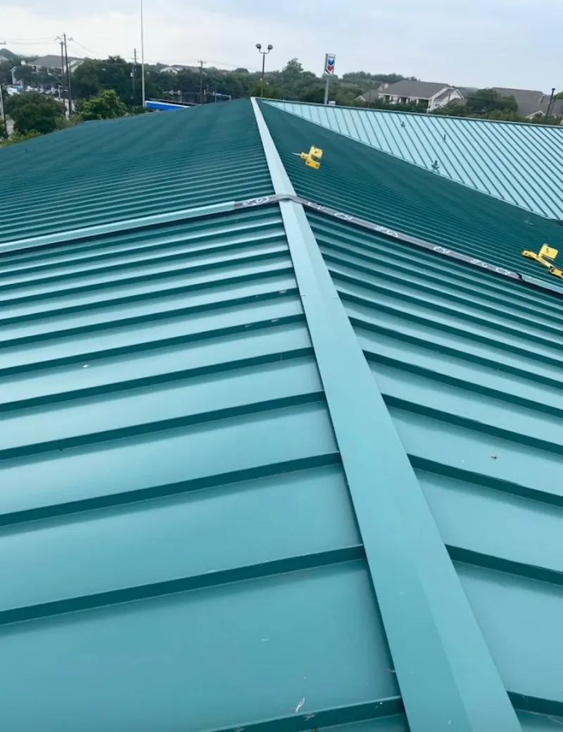 Green commercial metal roof ridge and valley for Metal Roof Repair in Schoolcraft